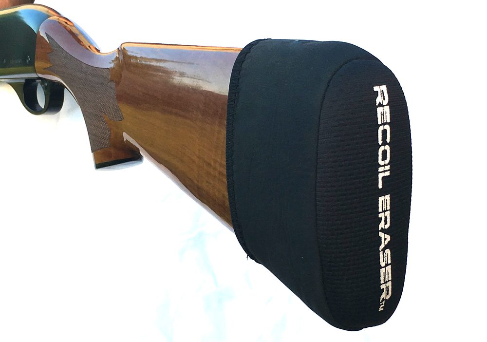 RECOIL ERASER black slip-on recoil pad fitted on a wood shotgun stock, logo printed on the pad